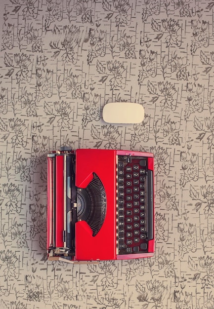 A vintage typewriter with sheet music and cryptic handwritten lyrics scattered around it, suggesting a creative process of deep lyrical introspection.