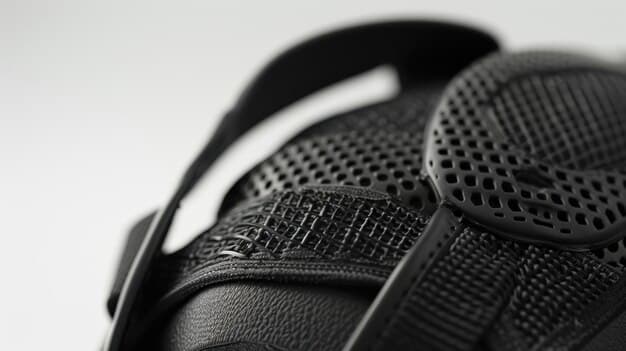 A close-up shot of a modern, multi-layered sports helmet, showcasing its intricate design and advanced cushioning, emphasizing safety features.