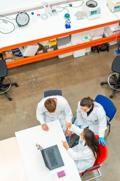 An overhead shot of researchers in a clean laboratory setting, wearing white lab coats and protective eyewear, meticulously preparing samples and operating advanced scientific equipment, symbolizing precision and rigorous methodology in clinical research.