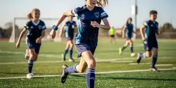Young athlete wearing wearable tech for safety and performance monitoring in youth sports.
